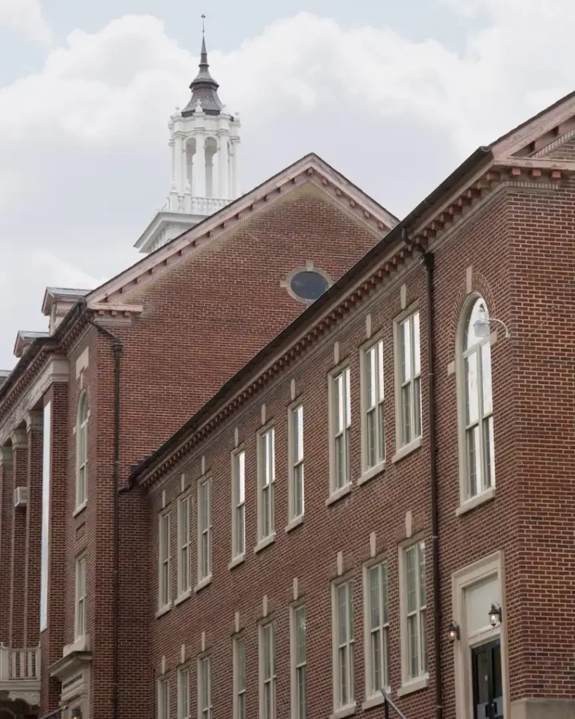Brick building with a white cupola on a Durham, NC area campus