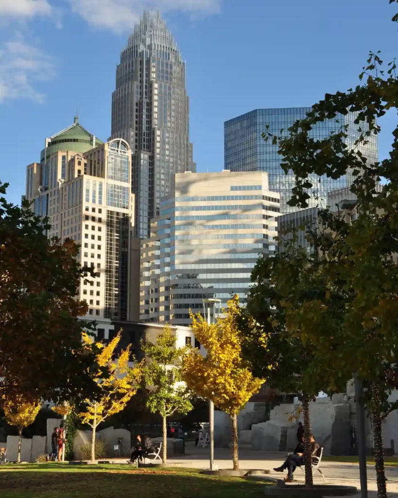 Autumn trees at Romare Bearden Park with the Charlotte, NC skyline in the background