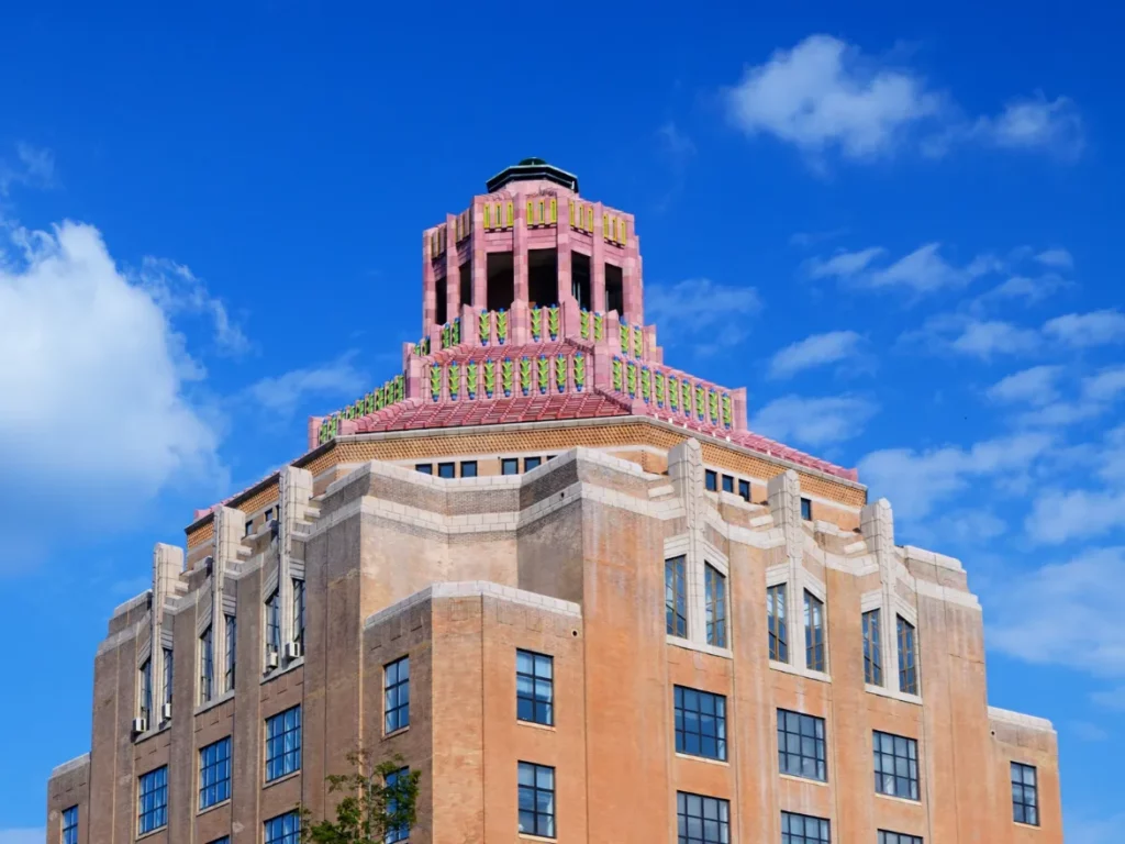 Art deco City Hall building in downtown Asheville, NC against a blue sky