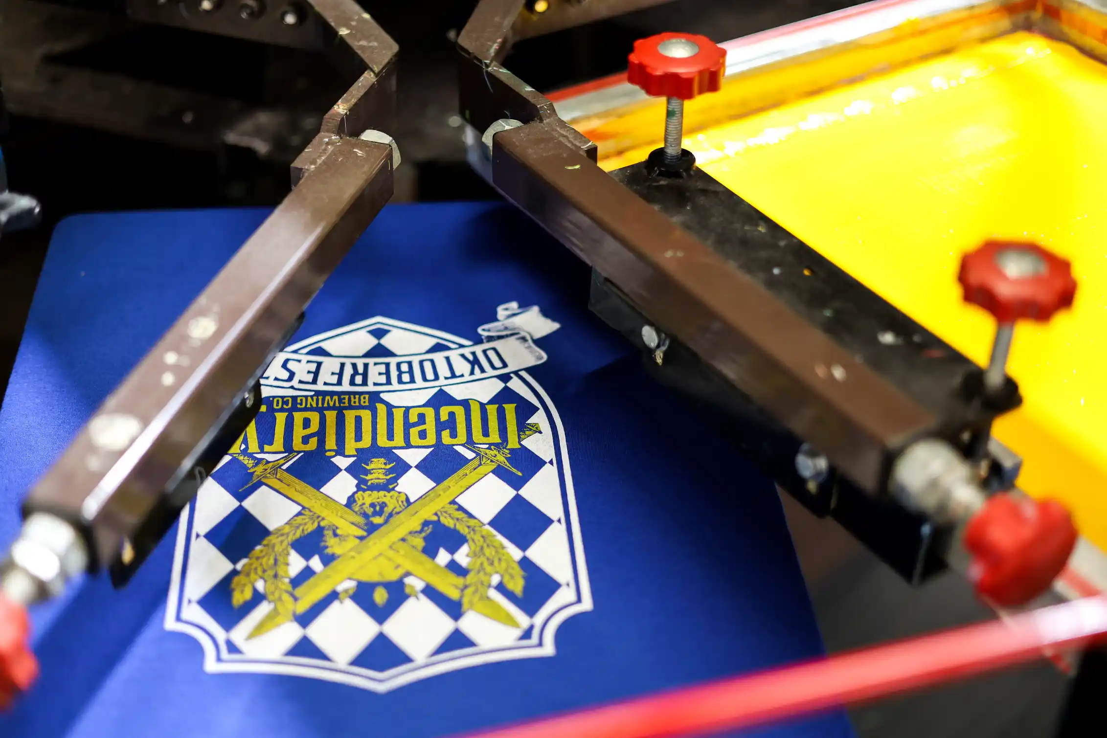 Yellow screen positioned to print the second color over the white base layer