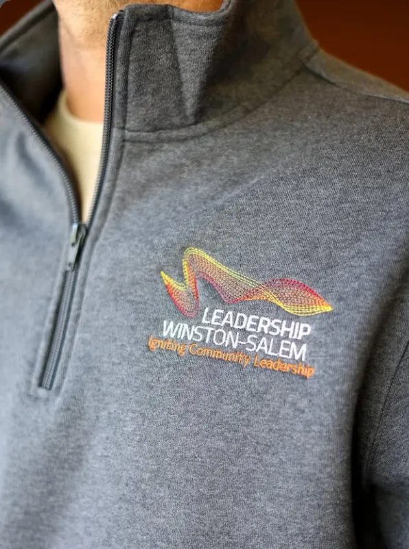 Custom embroidered quarter-zip pullover for corporate casual workwear by Sew NC
