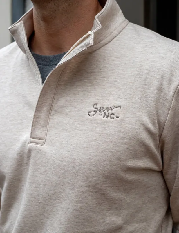 Custom embroidered quarter-zip pullover for corporate uniform outerwear programs